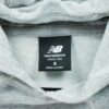 Sweat a capuche homme manches longues gris New Balance Motif chine Col Rond