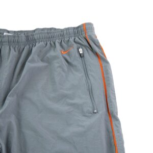 Nike pantalon de survetement gris a liseres orange