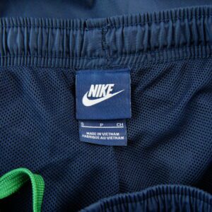 Nike Season Woven pantalon de survetement bleu marine a bandes vertes