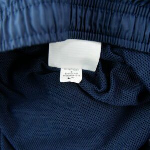 Nike Season Woven pantalon de survetement bleu marine a bandes vertes