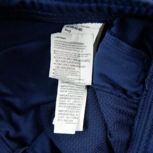 Pantalon de survetement Under Armour bleu marine a bandes blanches