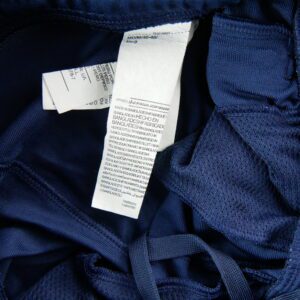 Pantalon de survetement Under Armour bleu marine a bandes blanches